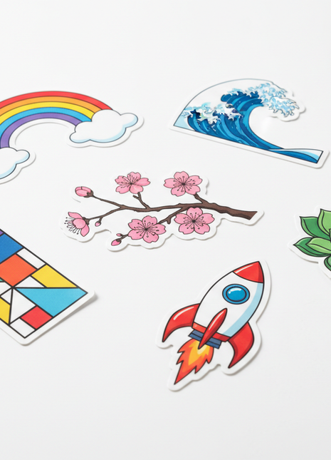 vytvoř mi fotografii ramolepek s výřezem okolo grafiky bez textů